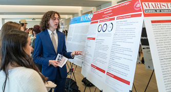 Image of student presenting academic research.