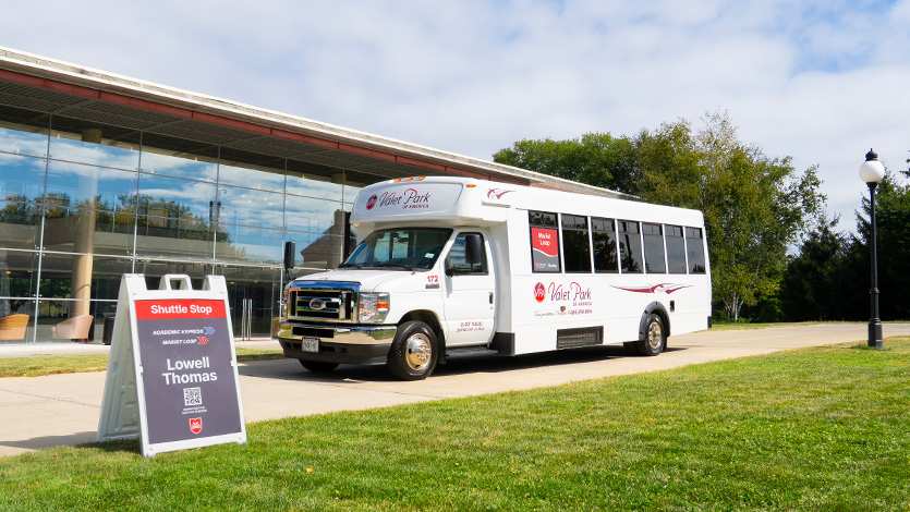 Image of shuttle bus in front of Lowell Thomas.