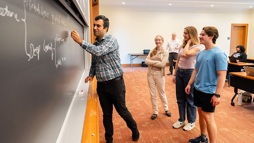 Faculty mentor Dr. Reza Sadeghi, Assistant Professor of Computer Science, works with students as part of the Statistical Mathematics and Research Training (SMART) REU program. Photo by Nelson Echeverria/Marist University.