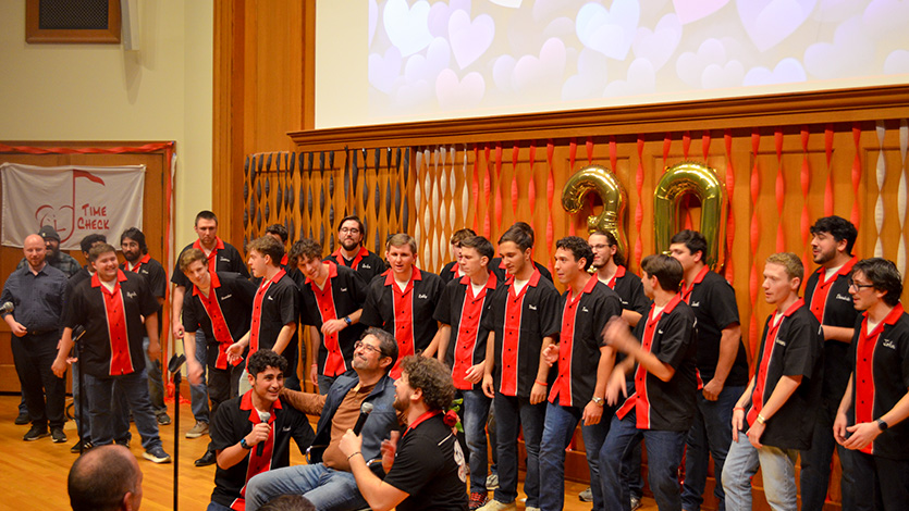 Members and alumni of Time Check serenade choral professor Bryan Lynch during the group’s 30th Anniversary Concert. Photo by Cira Shaw '26/Marist University. 