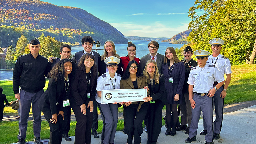 Image of Marist political science student Suzie Kolmel ’26 with her group from the SCUSA conference on West Point’s campus.