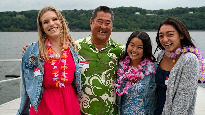 Image of students and Derrick Kang