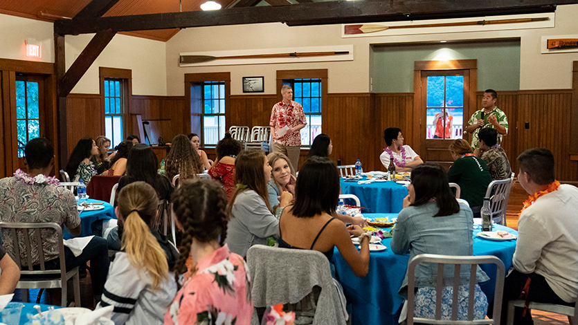Image of Sean Kaylor and Derrick Kang speaking to students at reception