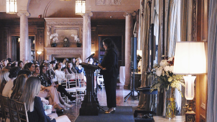 Guest speaker Melissa Joy Manning speaking at podium