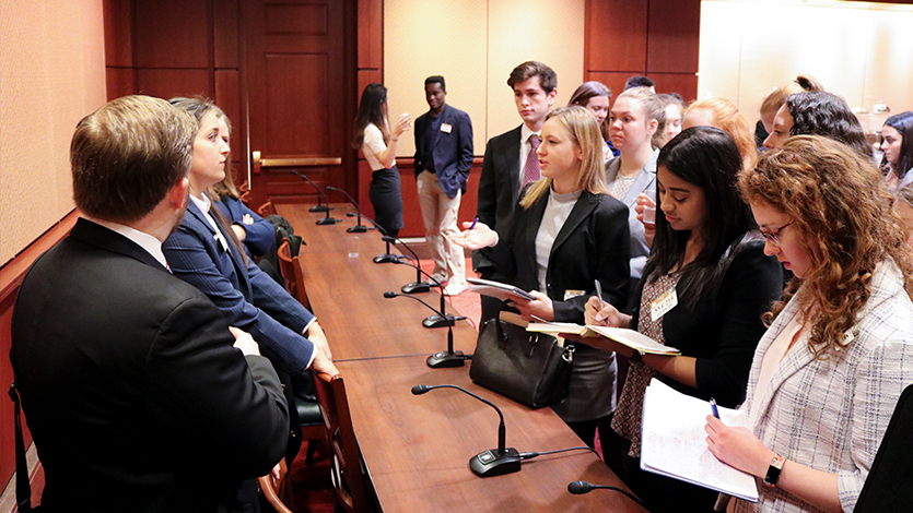 Gabriela Hasaj '19 (center) speaking to panelists after a career discussion