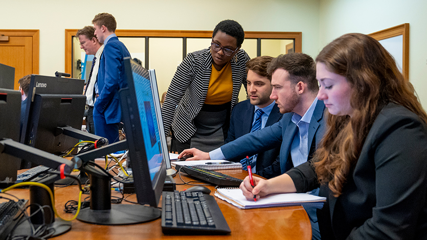 image of: School of Management students collaborating in the Investment Center. Photo by Carlo de Jesus/Marist College