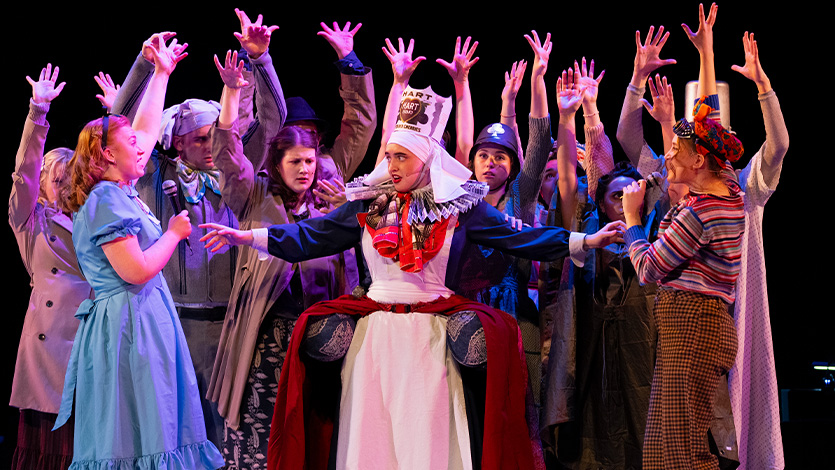 Image of the cast of Alice by Heart performing on stage at Marist University.