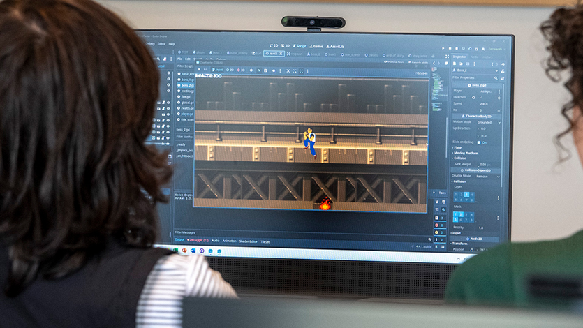 Image of students working on a computer game.