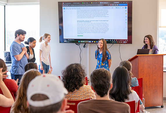 Image of students receiving feedback from Land to Learn on their project. Photo by Benson Delaney ‘27/Marist University.