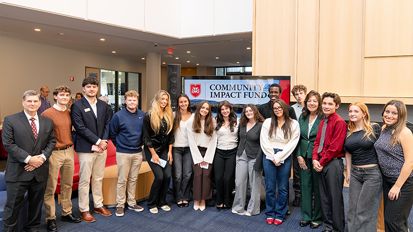 Dr. Jim Melitski, students, and Dutchess County Executive Sue Serino gather for the launch of the Community Impact Fund in the Dyson Center. Photo by Nelson Echeverria/Marist University.  