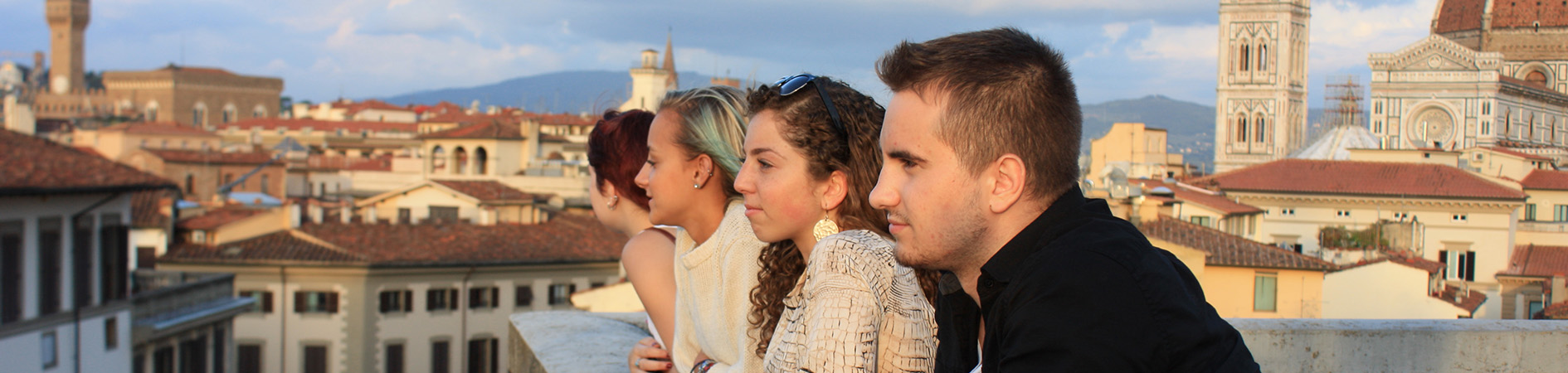 Photo of students looking off a rooftop at Florence