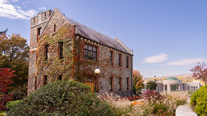 Image of Greystone with Student Center Rotunda in background.