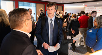 Image of a student speaking with a prospective employer at the Center for Career Services.