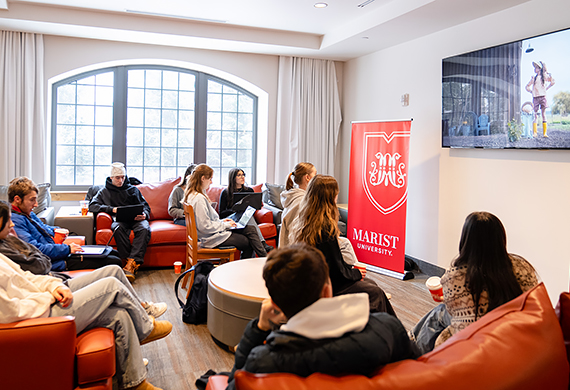 Marist students gather in Ward Hall to watch and rate Super Bowl Ads. 