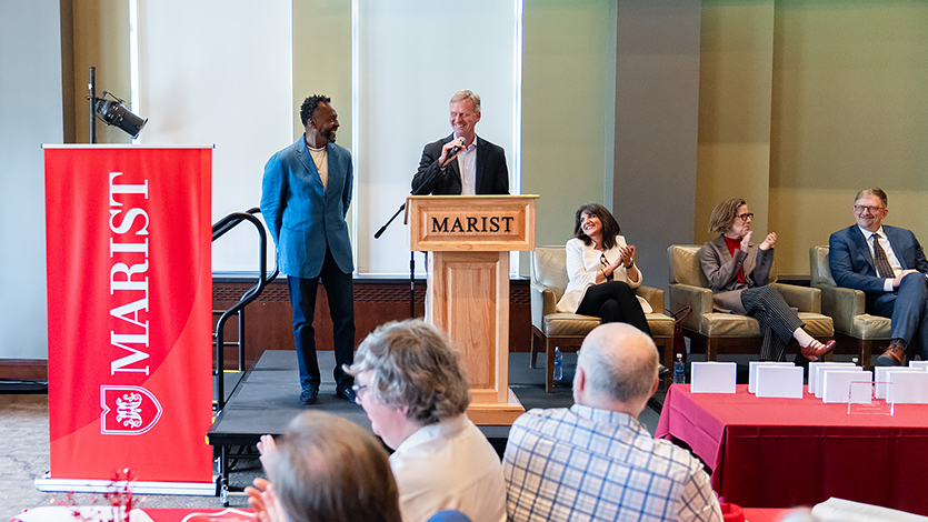 President Kevin Weinman recognizes Henry Graham for his career in Campus Safety and Security. Photo by Nelson Echeverria/Marist University.