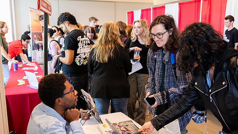 Image of a bustling Study Abroad fair in the Student Center.