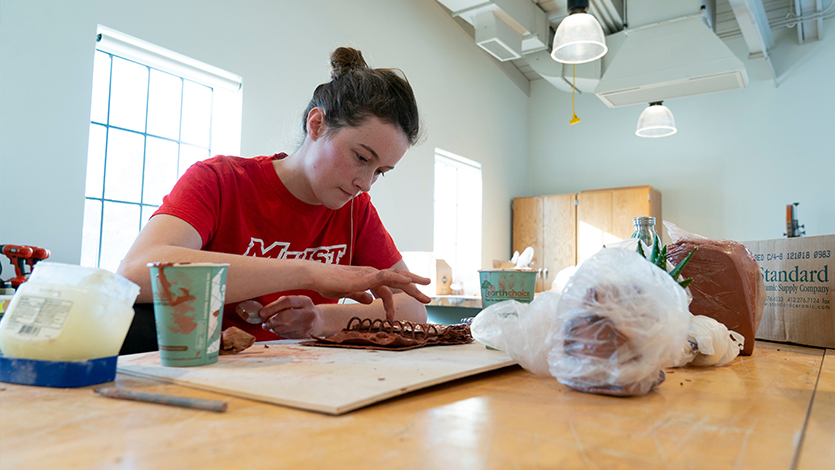 Mary McGrail working on a piece at the Steel Plant on the Poughkeepsie, NY campus
