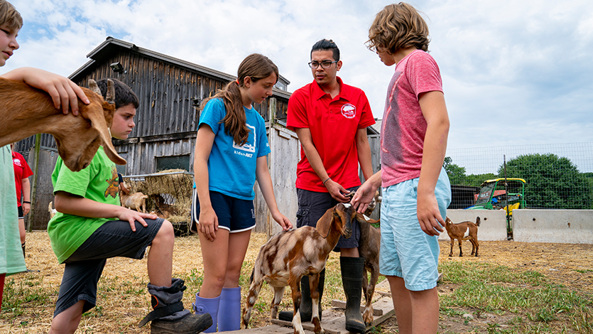 Yeison Ramirez ’21 working with overnight campers at the goat pen
