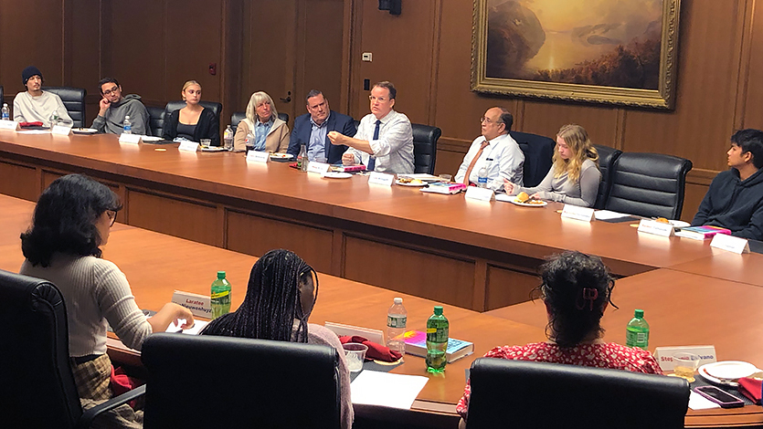 Image of Bump speaking with students.