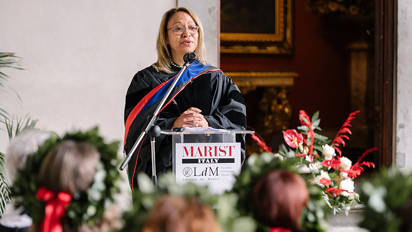 Image of Consul General Daniela Ballard, US Consul General of Tuscany, and Emilio Romagna speaking at Florence Commencement. 