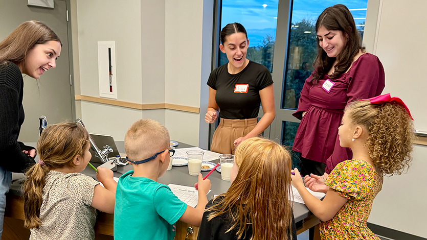 Image of Teacher Candidates Brooke Fanuele '25, Danielle Lipof '25, Jessica Goetchius '25 in the Teaching Methods lab on Marist STEM Night. 