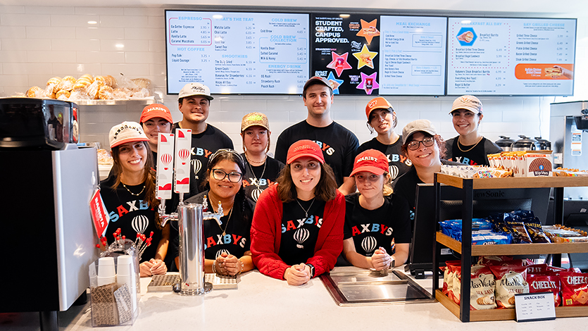 Image of Liana Perez, second from right at the opening of Saxbys.