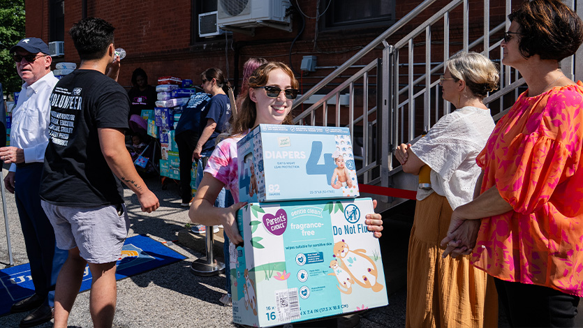 Image of Tarver intern Hannah Epstein 26 helping run a diaper drive with United Way.