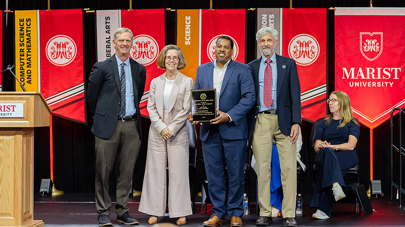 Image of President Kevin Weinman, Provost Dr. Catherine Gunther Kodat, Michael Lewis, Registrar, and Dr. Richard Feldman joined in celebrating the Office of the Registrar, recipient of the inaugural Distinguished Service Office Award. Photo by Nelson Echeverria/Marist University.