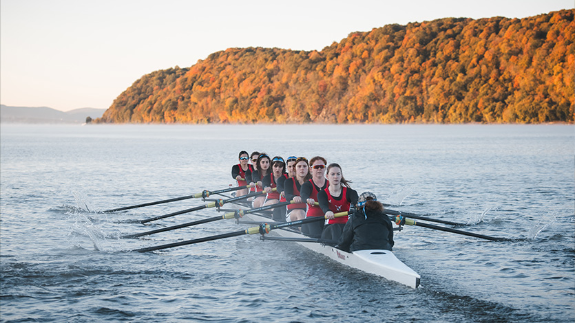 Carina leads her rowing team as a coxswain on the Hudson River. Photo courtesy of Marist Athletics.  