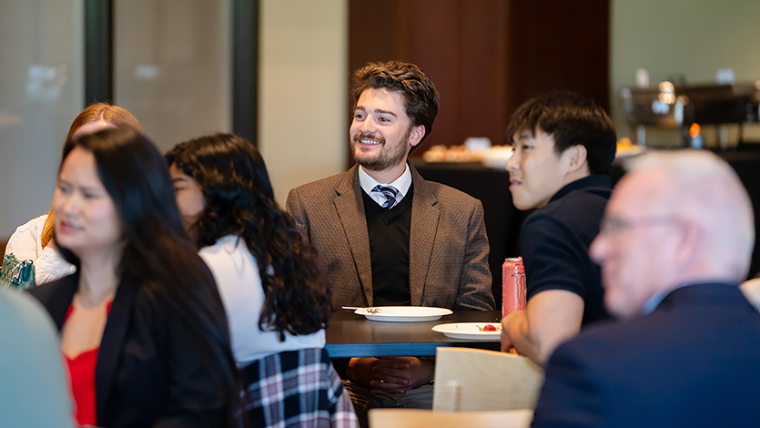 Jacob smiling at Tarver event. 