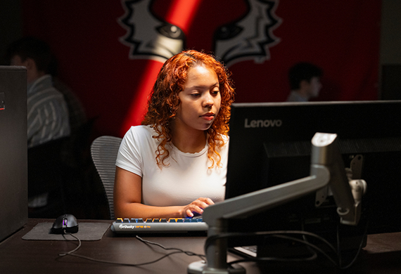Image of Marist University student working on a computer for Marist's AI Literacy Summer Pre-College program.