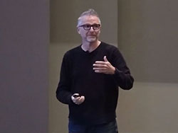 Image of C. Edward Watson speaking about AI at Marist University.