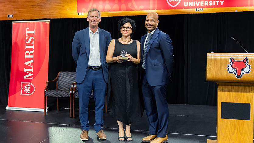 Image of Joanne D'Avanzo being recognized at Staff Convocation.