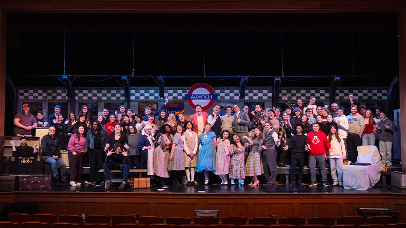 Image of cast and crew of Alice by Heart on stage at Marist University.