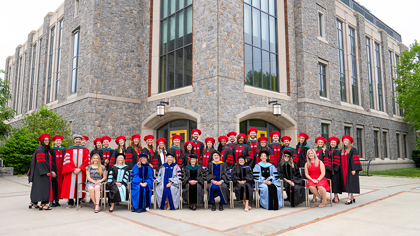Image of DPT graduates at their hooding ceremony and reception.
