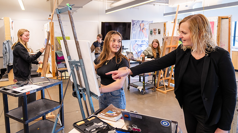 Image of students receiving feedback in their Studio Art class in the Steel Plant at Marist University.