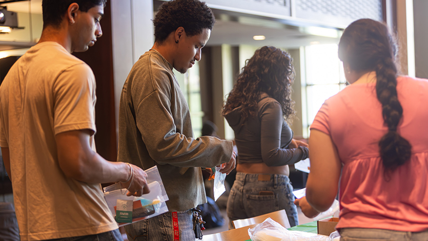 Image of Student volunteers help make community care kits for 9/11 Day. Photo by Emily Portnov '29/Marist University. 
