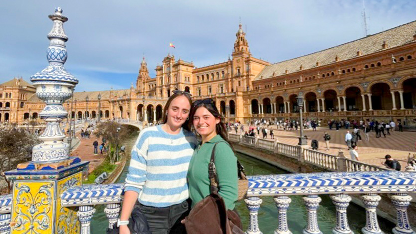 Marist University image: Rachel Dean and her friend pose in front of a piazza in Europe.