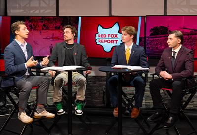 Marist University image: William with his colleagues on the set of the Red Fox Report.