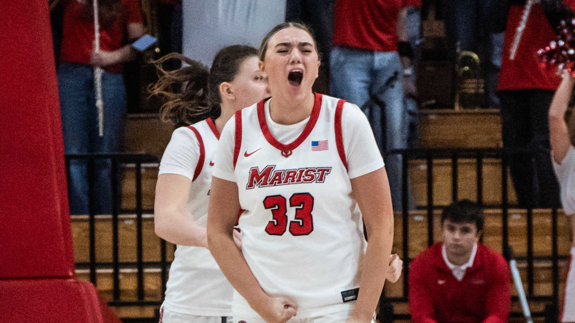 Image of Marist University women's basketball player Elle Bruschuk celebrating a victory.